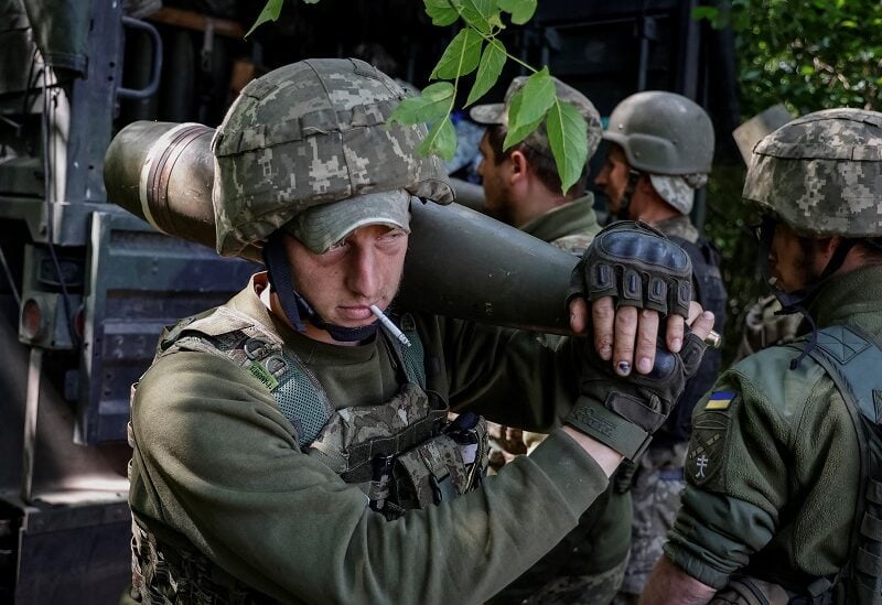 Ukrainian service members prepare shells for a M777 Howitzer near a frontline, as Russia's attack on Ukraine continues, in Donetsk Region, Ukraine June 6, 2022. REUTERS/Stringer