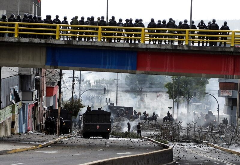 Riot police and demonstrators clash during an anti-government protest as opposition lawmakers push for the removal of Ecuador's conservative President Guillermo Lasso after nearly two weeks of mass protests led by indigenous groups demanding lower fuel and food prices, in Quito, Ecuador June 24, 2022. REUTERS/Karen Toro