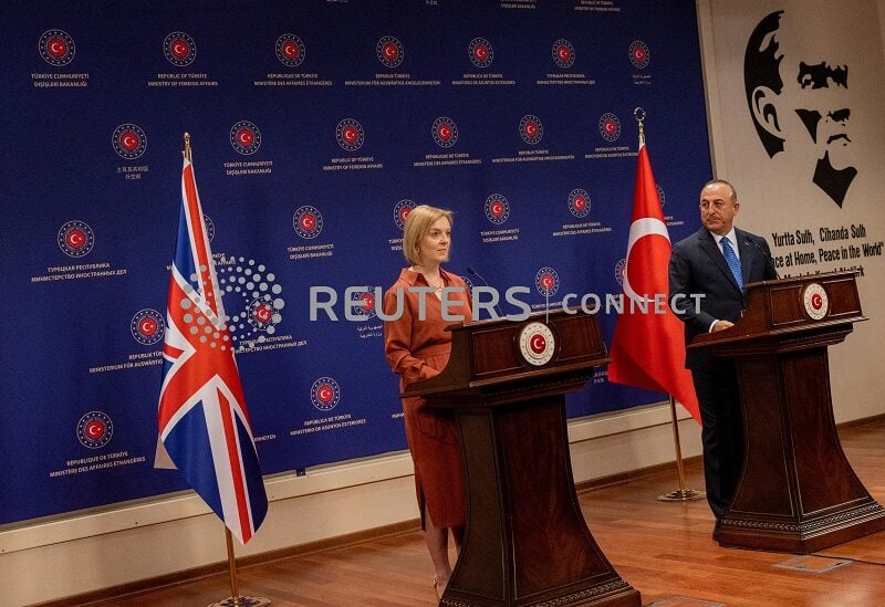 Turkish Foreign Minister Mevlut Cavusoglu and British Foreign Secretary Liz Truss attend a news conference in Ankara, Turkey, June 23, 2022. REUTERS/Umit Bektas