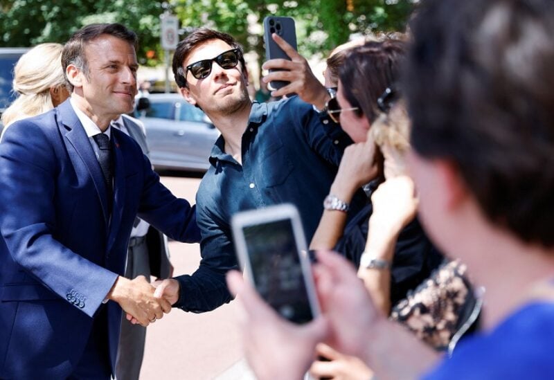 French President Emmanuel Macron poses for a picture during the first round of French parliamentary elections, at a polling station in Le Touquet, France, June 12, 2022. Ludovic Marin/Pool via REUTERS