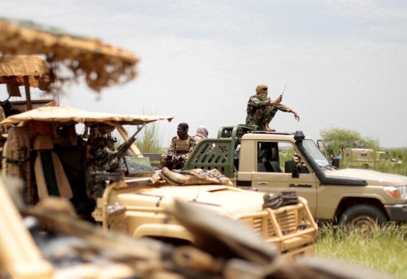 FILE PHOTO: Malian soldiers are pictured during a patrol with soldiers from the new Takuba force near Niger border in Dansongo Circle, Mali August 23, 2021. Picture taken August 23, 2021. REUTERS/Paul Lorgerie//File Photo