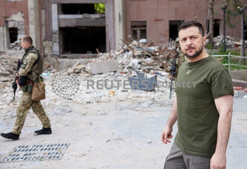 FILE PHOTO: Ukraine's President Volodymyr Zelenskiy walks on a street during a visit to the southern city of Mykolaiv, as Russia's attack on Ukraine continues, Ukraine June 18, 2022. Ukrainian Presidential Press Service/Handout via REUTERS