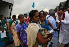 An ethnic minority Tamil woman arrives with her daughter to go to her native village after arriving from India on a passenger ferry at a Colombo port October 12, 2011. According to a press release from the U.N., they are among the first group of 37 refugees who are returning to the island nation after escaping to India 20 years ago due to a 25-year civil war between the government's military and the Liberation Tigers of Tamil Eelam (LTTE). REUTERS/Dinuka Liyanawatte
