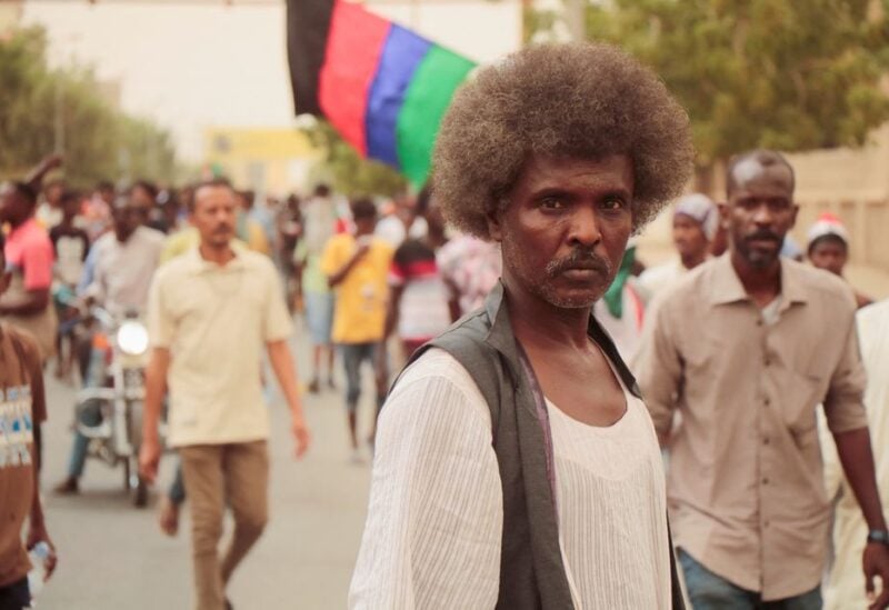 A man attends a march as people protest during a rally against military rule, following the last coup and to commemorate the 3rd anniversary of demonstrations, in Port Sudan, Red Sea State, Sudan June 30, 2022. REUTERS/Stringer