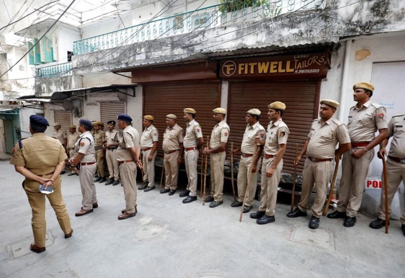 Police stand next to the shop of Kanhaiyalal Teli, a Hindu tailor, who was killed by two suspected Muslims after they videoed themselves slaying the Hindu tailor, in Udaipur in the northwestern state of Rajasthan, India, June 30, 2022. REUTERS/Amit Dave
