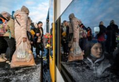 People fleeing Russian invasion of Ukraine change trains at Euroterminal to be transferred to temporary accommodation centers around the country, in Slawkow, Poland March 5, 2022. Grzegorz Celejewski/Agencja Wyborcza.pl via REUTERS