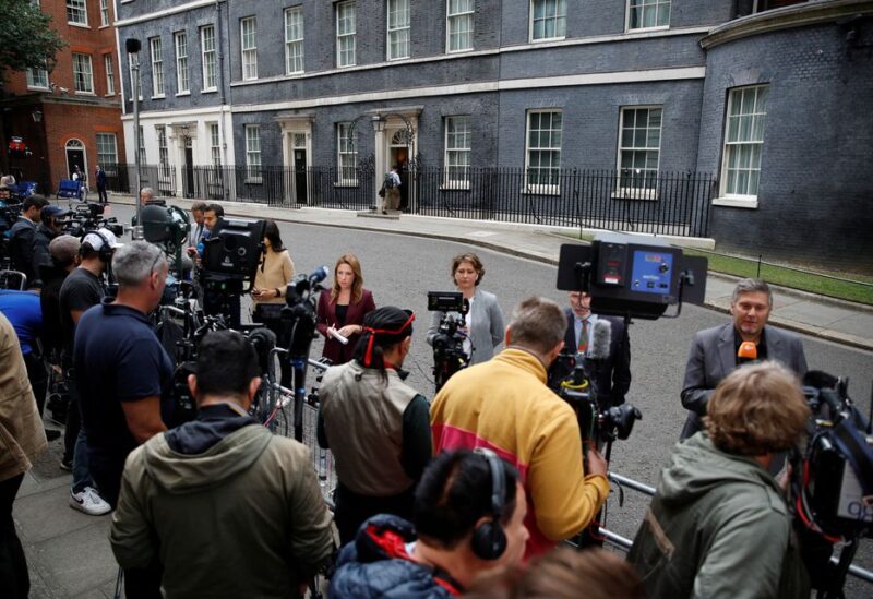 Members of the media wait outside 10 Downing Street, where British Prime Minister Boris Johnson is expected to make a statement, in London, Britain, July 7, 2022. REUTERS/Peter Nicholls