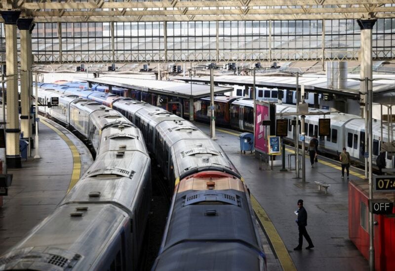 A view of trains on the platform at Waterloo Station as a station worker stands nearby, on the first day of national rail strike in London, Britain, June 21, 2022. REUTERS/Henry Nicholls