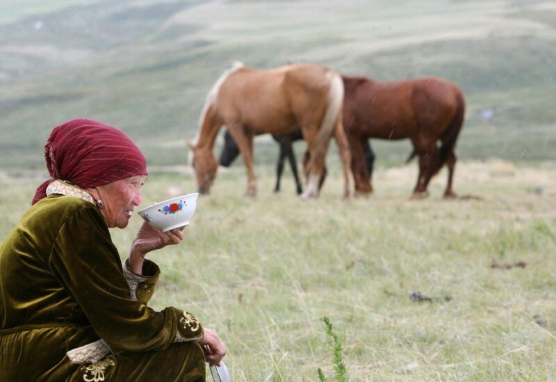 A Kyrgyz woman drinks horse milk at a high altitude summer pasture called Suusamyr, some 170 km (106 miles) south of the Kyrgyz capital Bishkek, June 17, 2011 REUTERS/Vladimir Pirogov
