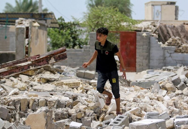 An Iranian man walks amid the rubble after an earthquake in Sayeh Khosh village in Hormozgan, Iran, July 2, 2022. ISNA/WANA (West Asia News Agency) via REUTERS