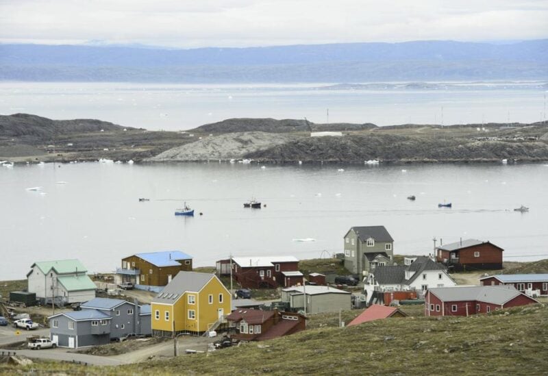 FILE - Small boats make their way through the Frobisher Bay inlet in Iqaluit, Nunavut, Canada on Friday, Aug. 2, 2019. In his extensive papal travels, Pope Francis has never journeyed further north than Iqaluit, the capital city of the Inuit-governed territory of Nunavut in northern Canada. On Friday, July 28, 2022, it will be the third and final stop of the pope's six-day Canadian visit, focused on apologies for abuses of Indigenous youths at Catholic-run boarding schools.(Sean Kilpatrick/The Canadian Press via AP, File)
