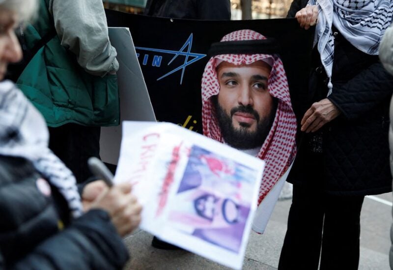 Demonstrators rally against the visit of Saudi Crown Prince Mohammed bin Salman with Wall Street executives in Manhattan, New York, U.S., March 26, 2018. REUTERS/Shannon Stapleton
