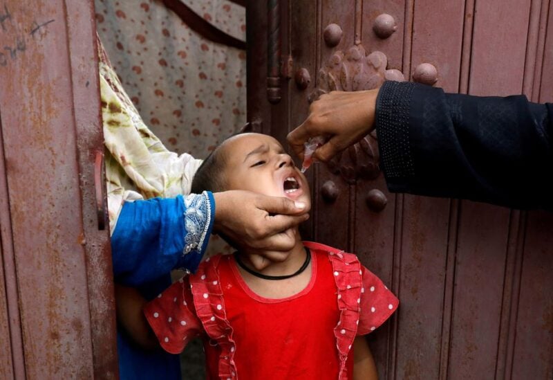 A girl receives polio vaccine drops, during an anti-polio campaign, in a low-income neighborhood as the spread of the coronavirus disease (COVID-19) continues, in Karachi, Pakistan July 20, 2020. REUTERS/Akhtar Soomro