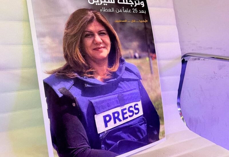 A picture of Al Jazeera reporter Shireen Abu Akleh, who was killed during an Israeli raid in Jenin, is displayed at the Al-Jazeera headquarters building in Doha, Qatar, May 11, 2022. REUTERS/Imad Creidi