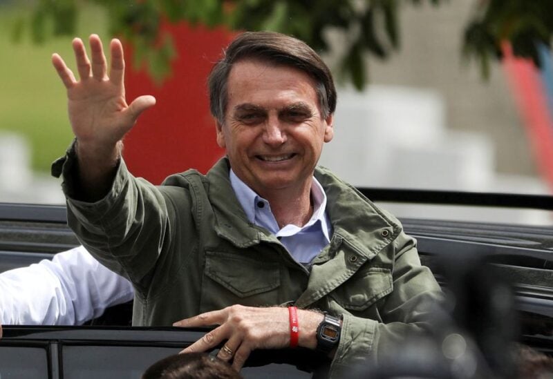Jair Bolsonaro, far-right lawmaker and presidential candidate of the Social Liberal Party (PSL), gestures at a polling station in Rio de Janeiro, Brazil October 28, 2018. REUTERS/Pilar Olivares