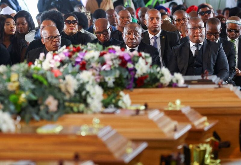 South African President Cyril Ramaphosa looks on as he joins mourners gathered in the coastal city of East London to grieve the still-mysterious deaths of 21 teenagers in a poorly ventilated local tavern, in East London, in the Eastern Cape province, South Africa, July 6, 2022. REUTERS/Siphiwe Sibeko