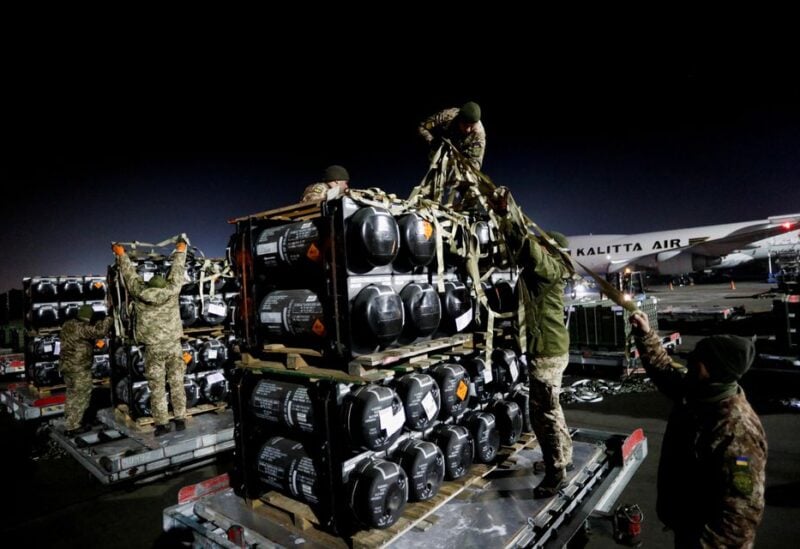 Ukrainian service members unpack Javelin anti-tank missiles, delivered by plane as part of the U.S. military support package for Ukraine, at the Boryspil International Airport outside Kyiv, Ukraine February 10, 2022. REUTERS/Valentyn Ogirenko