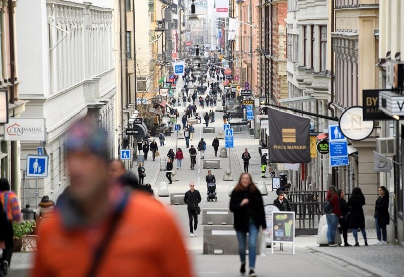 People walk on Drottninggatan, the main shopping street in Stockholm, amid the new coronavirus (COVID-19) spread, in Sweden March 27, 2020. Picture taken March 27, 2020. Henrik Montgomery/TT News Agency/via REUTERS