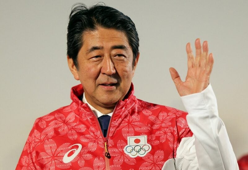 FILE PHOTO: Japanese Prime Minister Shinzo Abe visits the Japan House to greet his country's Olympic athletes and delegates, in Rio de Janeiro August 21, 2016. REUTERS/Bruno Kelly/File Photo