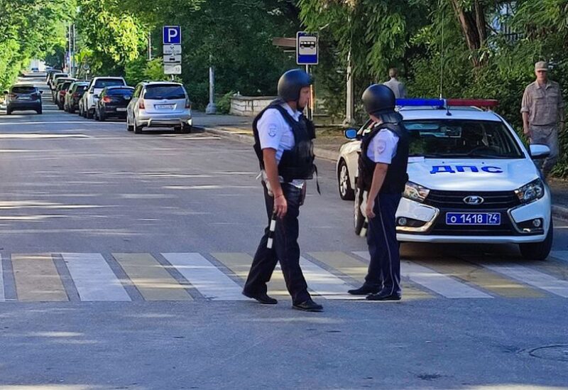Law enforcement officers block a street following a reported combat drone attack on the Russian Black Sea Fleet's headquarters in Sevastopol, Crimea