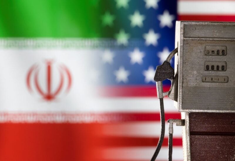 Model of petrol pump is seen in front of U.S. and Iran flag colors in this illustration taken March 25, 2022. REUTERS/Dado Ruvic/Illustration