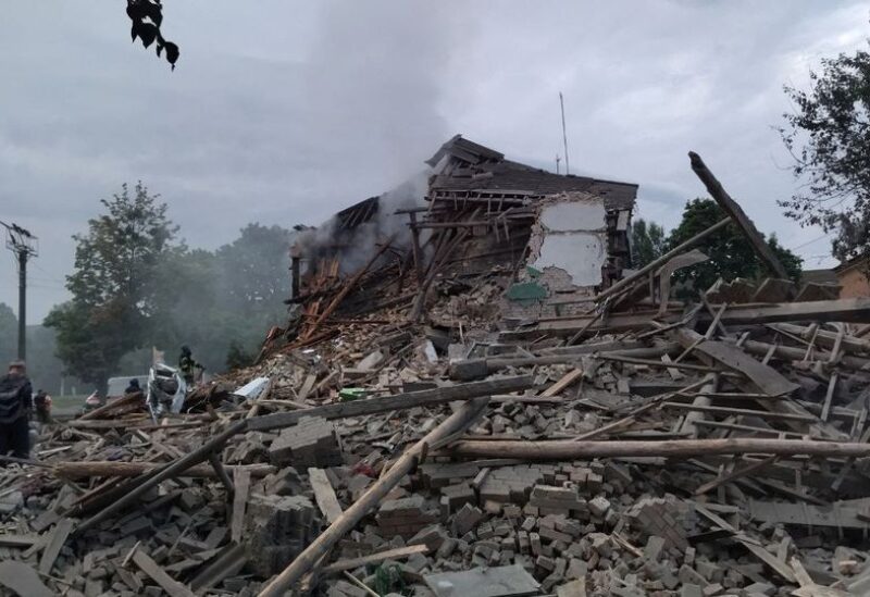 Emergency crew work amidst collapsed building site in Chuhuiv Town, Kharkiv, Ukraine, in this handout image obtained by REUTERS on July 16, 2022. State Emergency Service of Ukraine/Handout via REUTERS