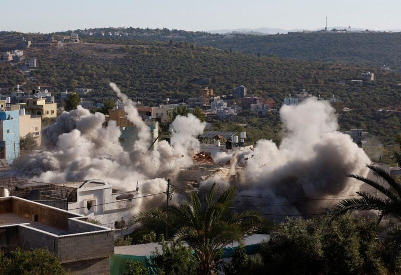 Israeli forces blow up the house of assailant Palestinian militant Yahya Mari, in Qarawat Bani Hassan in the Israeli-occupied West Bank July 26, 2022. REUTERS/Mohamad Torokman