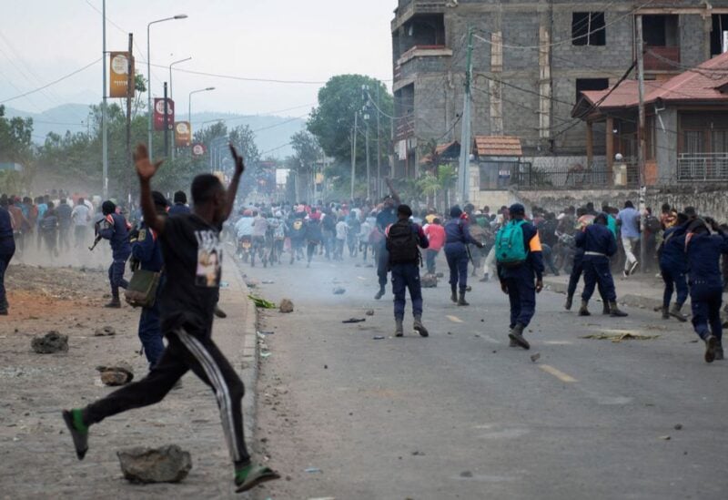Congolese policemen disperse protesters along the road near the compound of a United Nations peacekeeping force's warehouse in Goma in the North Kivu province of the Democratic Republic of Congo July 26, 2022. REUTERS/Arlette Bashizi
