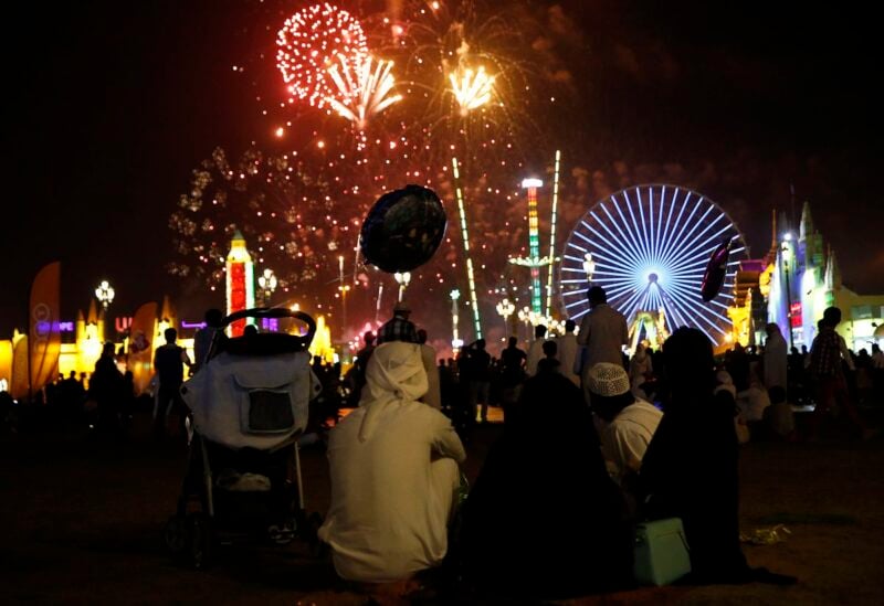 An Emirati family watches the fireworks display at the Global Village in Dubai February 13, 2015. REUTERS/Ahmed Jadallah/File Photo