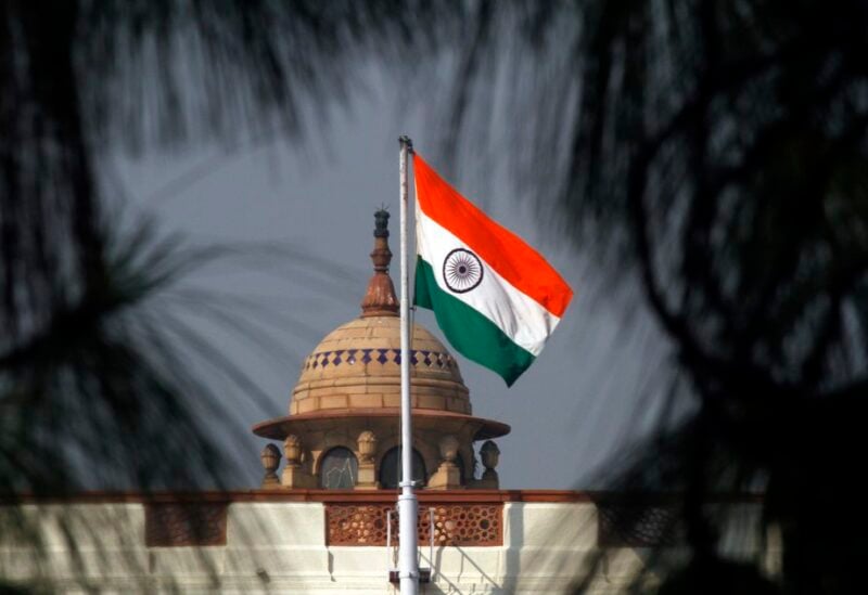 An Indian national flag flutters on top of the Indian parliament building in New Delhi December 1, 2010. REUTERS/B Mathur