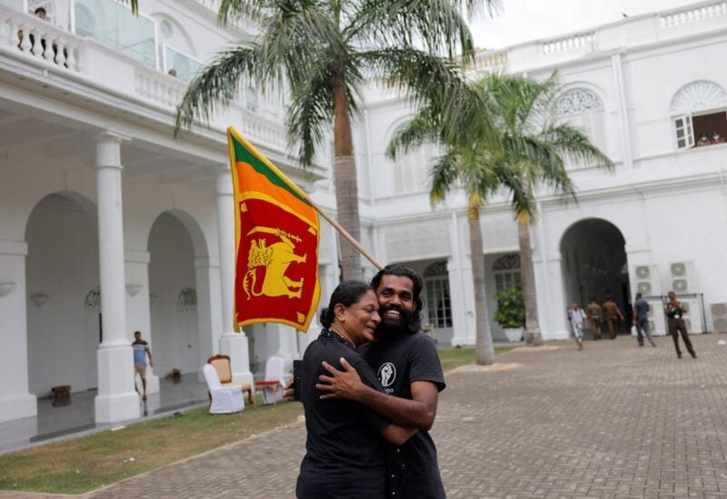 Demonstrators celebrate the following morning after they entered the President's house, after President Gotabaya Rajapaksa fled, amid the country's economic crisis, in Colombo, Sri Lanka July 10, 2022. REUTERS/Dinuka Liyanawatte