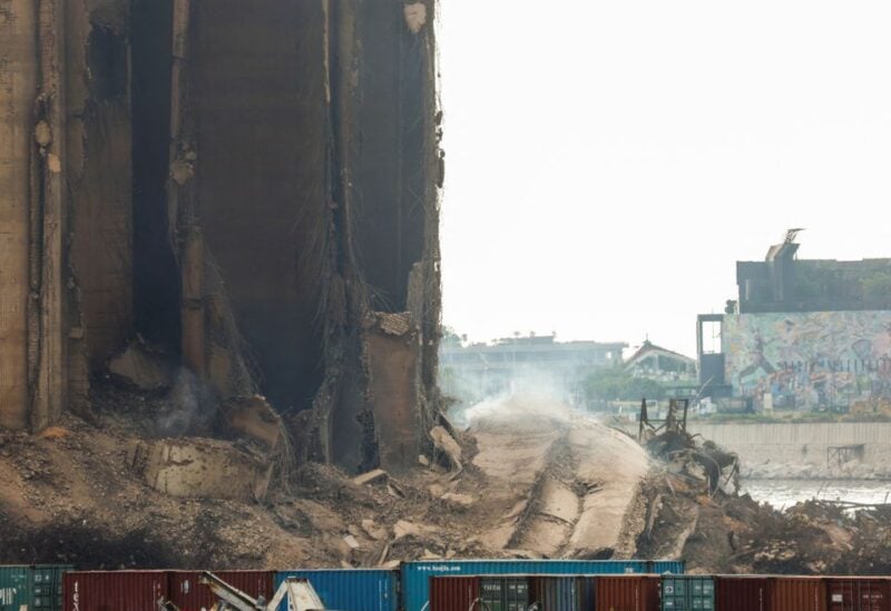 Dust rises as part of Beirut grain silos, damaged in the August 2020 port blast, collapses in Beirut Lebanon July 31, 2022