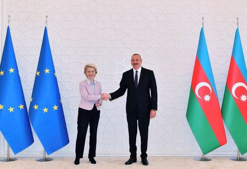 Azerbaijani President Ilham Aliyev shakes hands with European Commission President Ursula von der Leyen during a meeting in Baku, Azerbaijan, July 18, 2022. Official web-site of the President of the Republic of Azerbaijan/Handout via REUTERS ATTENTION EDITORS - THIS IMAGE HAS BEEN SUPPLIED BY A THIRD PARTY. NO RESALES. NO ARCHIVES. MANDATORY CREDIT.