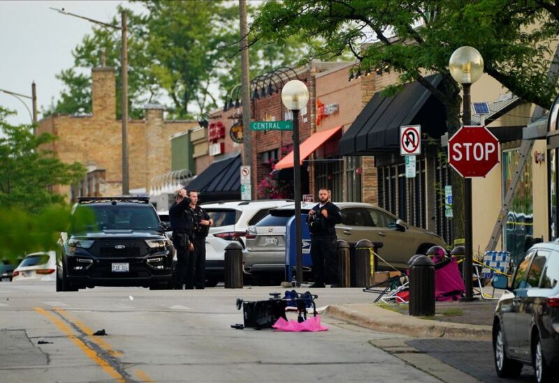 Police block a street after a mass shooting at a Fourth of July parade route in the wealthy Chicago