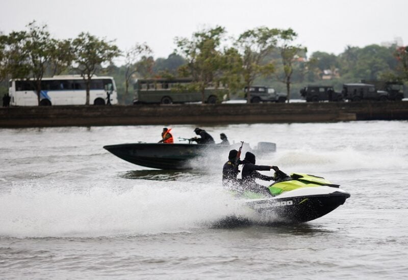 Security personnel patrol on a jet ski as armoured vehicles are seen inside the premises of the Parliament building, as voting begins to elect the new President, amid the country's economic crisis, in Colombo, Sri Lanka July 20, 2022. REUTERS/Adnan Abidi