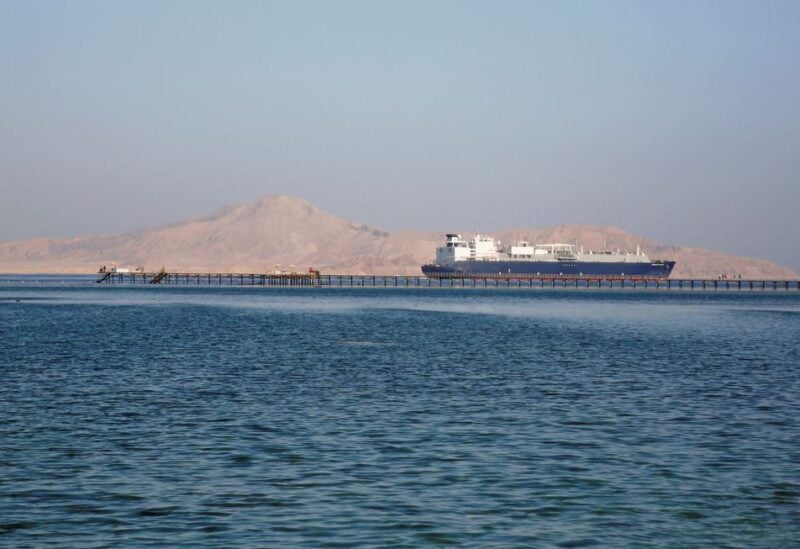 A container ship passes by a beach in the Aqaba Gulf in front of Tiran island which transferred into Saudi Arabia in 2017 off the Red Sea resort of Sharm el-Sheikh, Egypt July 12, 2018