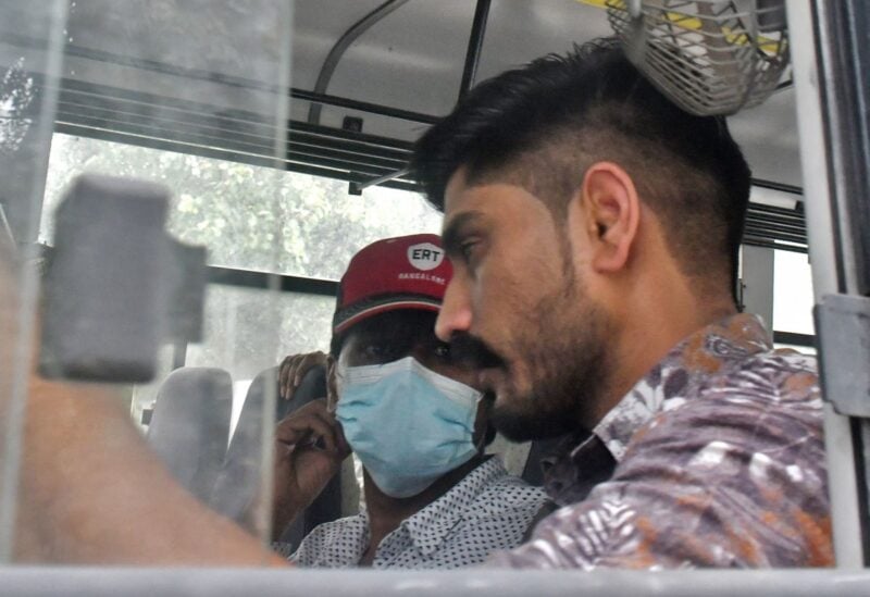 Mohammed Zubair, a journalist and a co-founder of fact-checking website Alt News sits in a police vehicle outside a court in New Delhi, India, June 28, 2022. REUTERS/Shashi Shekhar Kashyap