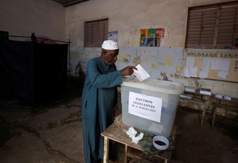 A man casts his ballot during the parliamentary election, in Pikine, on the outskirts of Dakar, Senegal, July 31, 2022
