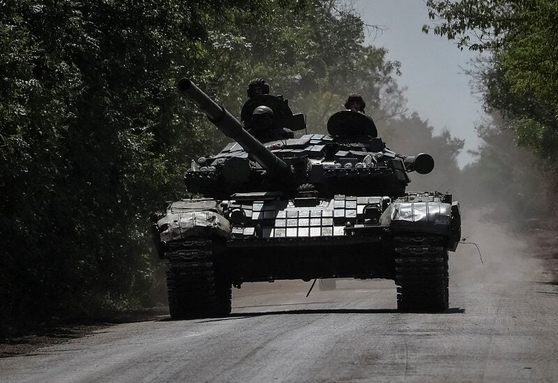 Ukrainian servicemen ride a tank near a frontline, amid Russia's attack on Ukraine, in Donbas region, Ukraine July 13, 2022.