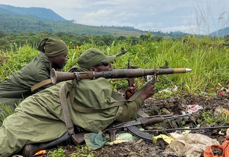 FILE PHOTO: Armed Forces of the Democratic Republic of the Congo (FARDC) soldiers take their position following renewed fighting near the Congolese border with Rwanda, outside Goma in the North Kivu province of the Democratic Republic of Congo May 28, 2022. REUTERS/Djaffar Sabiti/File Photo