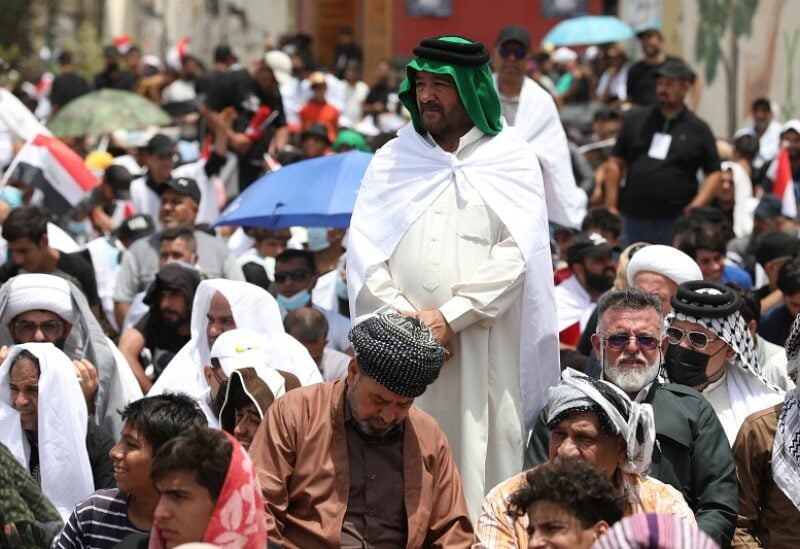 Supporters of Shi'ite cleric Moqtada al-Sadr gather for mass Friday prayer in the Sadr City district of Baghdad, Iraq, July 15, 2022. REUTERS/Wissam Al-Okaili