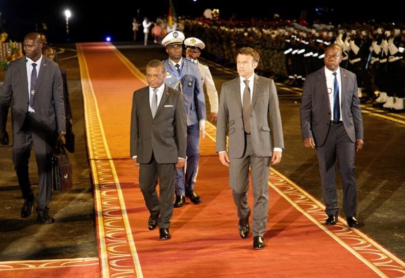 French President Emmanuel Macron is welcomed by Cameroon's Prime Minister Joseph Dion Ngute on his arrival in Yaounde, Cameroon July 25, 2022. REUTERS/Desire Danga Essigue. NO RESALE NO ARCHIVE