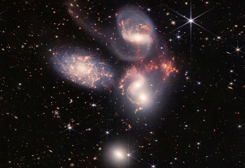 A group of five galaxies that appear close to each other in the sky: two in the middle, one toward the top, one to the upper left, and one toward the bottom are seen in a mosaic or composite of near and mid-infrared data from NASA's James Webb Space Telescope, a revolutionary apparatus designed to peer through the cosmos to the dawn of the universe and released July 12, 2022. NASA, ESA, CSA, STScI, Webb ERO Production Team/Handout via REUTERS THIS IMAGE HAS BEEN SUPPLIED BY A THIRD PARTY.