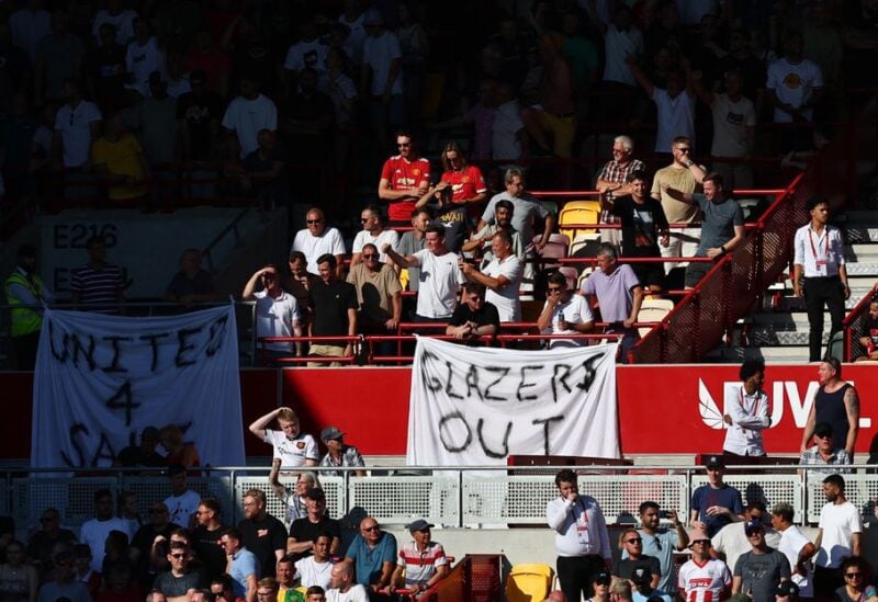 FILE PHOTO" Soccer Football - Premier League - Brentford v Manchester United - Brentford Community Stadium, London, Britain - August 13, 2022 Manchester United fans display banners in protest of the Glazer family’s ownership of the club inside the stadium before the match REUTERS/David Klein