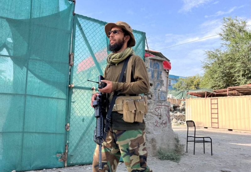 A Taliban fighter stands guard near the site where Al Qaeda leader Ayman al-Zawahiri was killed in a U.S. strike over the weekend, in Kabul, Afghanistan, August 2, 2022. REUTERS/Stringer