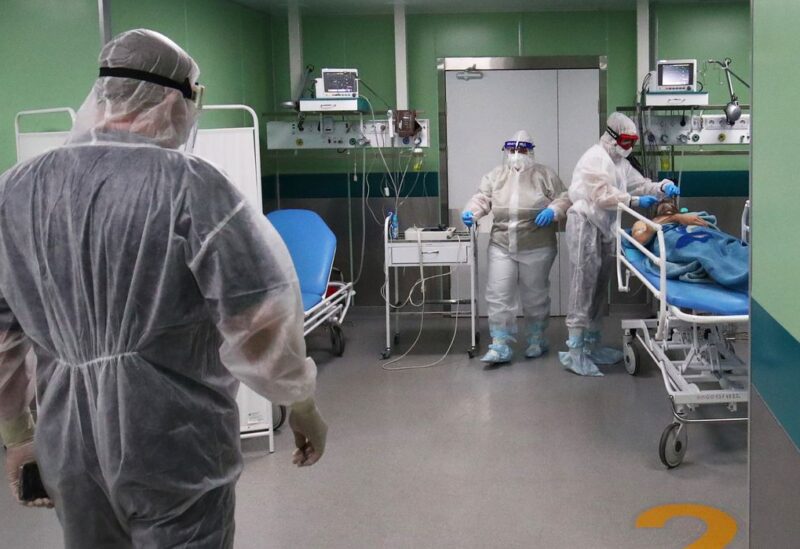 Medical specialists wearing protective gear work at the Intensive Care Unit (ICU) of the City Clinical Hospital Number 1, where people suffering from the coronavirus disease (COVID-19) are treated, in Volzhsky, Russia October 25, 2021. REUTERS/Kirill Braga