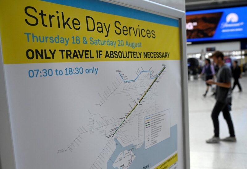 A train timetable information message is displayed, as rail workers in Britain strike over pay and terms, at Waterloo Station in London, Britain, August 18, 2022. REUTERS/Toby Melville