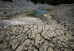 Cracked and dry earth is seen on the banks of Le Broc lake, as a historical drought hits France, August 5, 2022