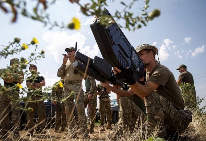 Ukrainian servicemen hold anti-drone guns as they take part in a training exercise not far from the front line in Mykolaiv region, as Russia's attack on Ukraine continues, Ukraine August 14, 2022. REUTERS/Anna Kudriavtseva