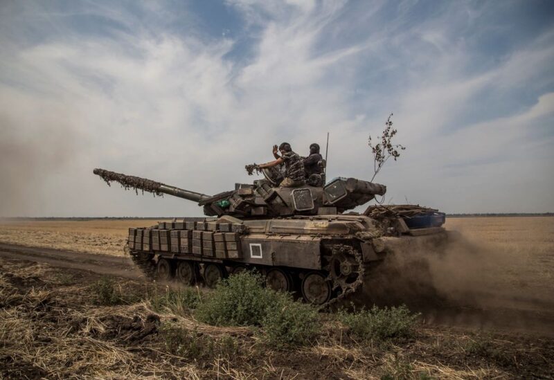 Ukrainian servicemen ride atop a tank near a front line in Mykolaiv region, as Russia's attack on Ukraine continues, Ukraine August 10, 2022. REUTERS/Oleksandr Ratushniak